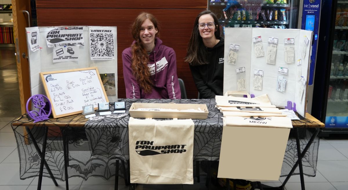 Image showing student and staff member at the 2025 Halloween market 